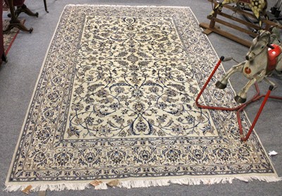 Lot 1148 - Nain Carpet, the ivory field of scrolling...