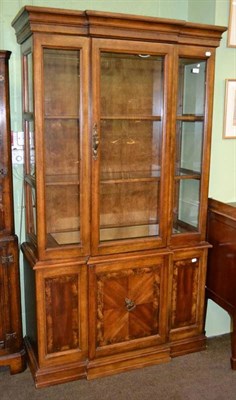 Lot 399 - A reproduction breakfront display cabinet