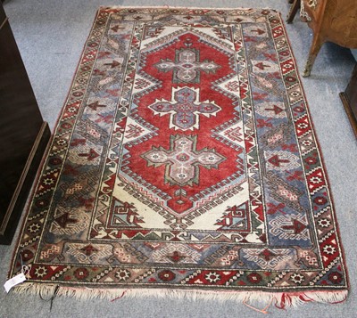 Lot 214 - Dosemealti Rug, the brick red field with three...