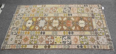 Lot 1007 - Melas Rug, the pale tan field with a column of...