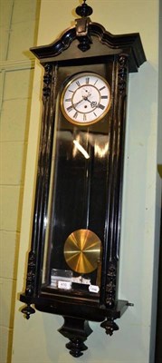 Lot 410 - An ebonised Vienna type wall timepiece