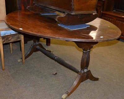 Lot 419 - Regency style oval table with brass paw feet