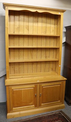 Lot 1223 - A Modern Oak Bookcase, with adjustable shelves...