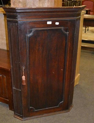 Lot 429 - A 19th century oak corner cabinet