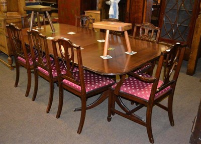 Lot 431 - A reproduction mahogany dining table, eight chairs and a similar sideboard