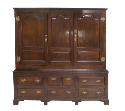 Lot 1102 - A George III Oak Livery Cupboard, 2nd half...