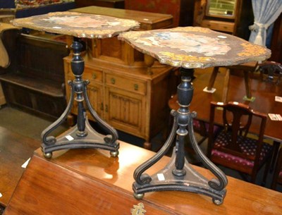 Lot 440 - A pair of Regency ebonised and parcel gilt tripod tables (poor order), 65cm high