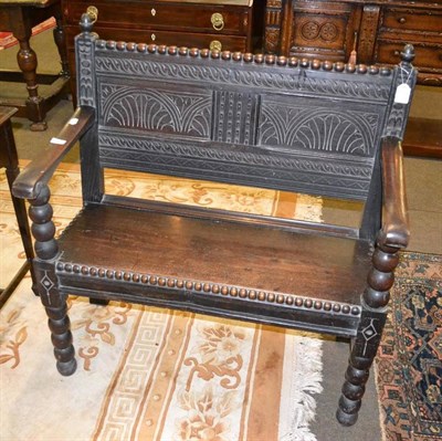 Lot 445 - Small carved oak settle