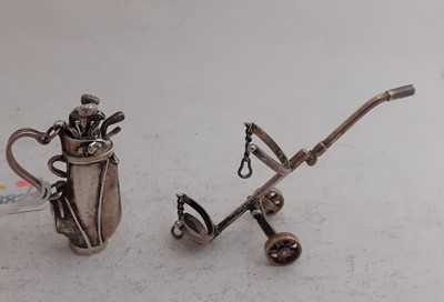 Lot 2073 - An American Miniature Silver Model Golf-Bag, Cart and Clubs