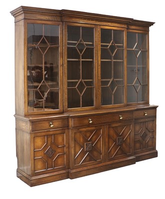 Lot 1128 - An Early 20th Century Carved Oak Four-Door...