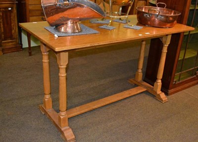 Lot 455 - A blonde oak small dining table