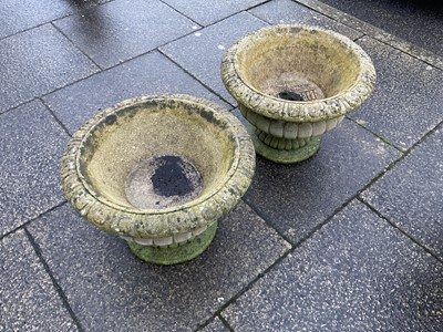 Lot 695 - A Pair of Reconstituted Stone Garden Urns, of...