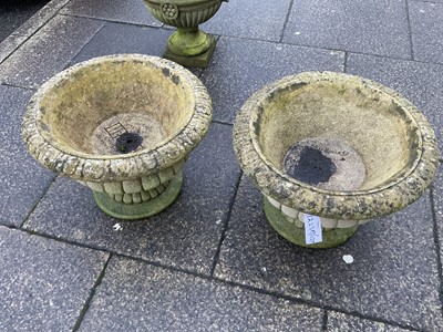 Lot 695 - A Pair of Reconstituted Stone Garden Urns, of...