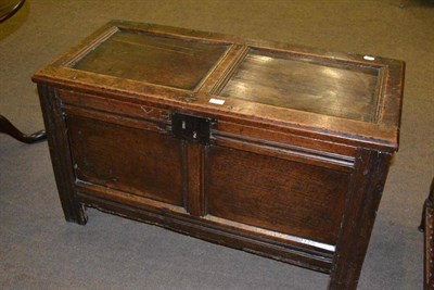 Lot 463 - A 17th century joined oak chest with hinged lid and carved initials 'MH'