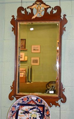 Lot 479 - A mahogany fret carved wall mirror