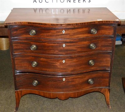 Lot 481 - A George III style mahogany serpentine chest of four graduated drawers