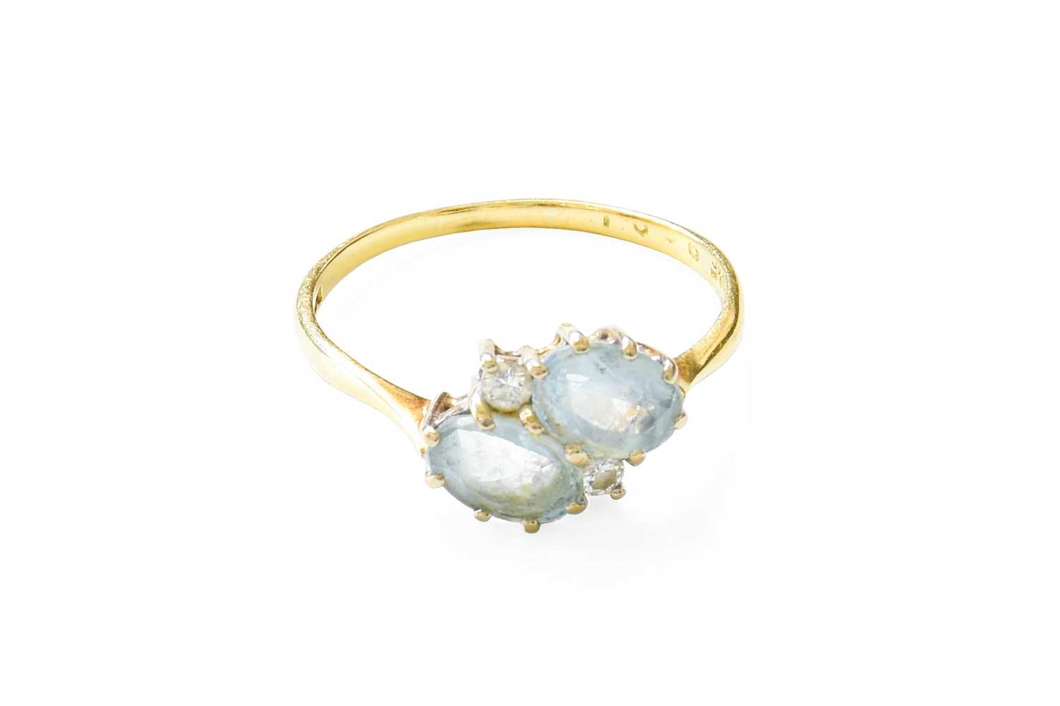Lot 426 - An 18 Carat Gold Aquamarine and Diamond Ring,...