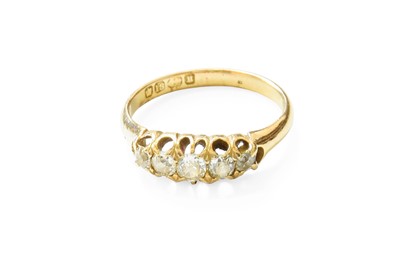 Lot 419 - An 18 Carat Gold Diamond Five Stone Ring, the...