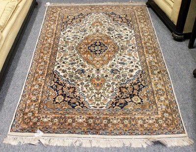 Lot 1143 - Indian Rug, the ivory field of vines around a...