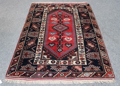 Lot 207 - Dosemealti Rug, the raspberry lozenge field...