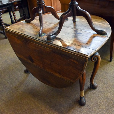 Lot 1324 - An 18th Century Oak Gateleg Table, on scroll...