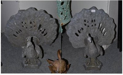 Lot 553 - Pair of lead peacock ornaments