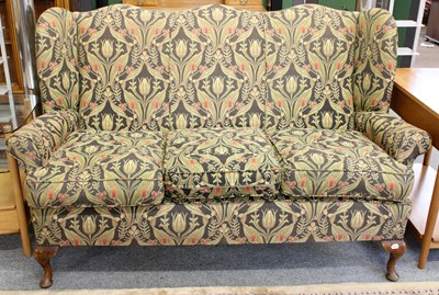 Lot 137 - A Wing Back Three Seater Settee, with shaped...