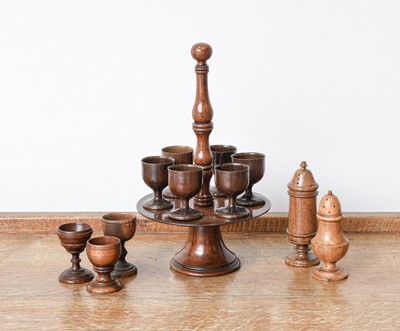 Lot A Fruitwood Treen Egg Stand and Six Cups,...