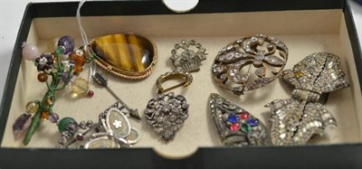 Lot 9 - A tiger's eye set brooch/pendant, several paste set brooches etc