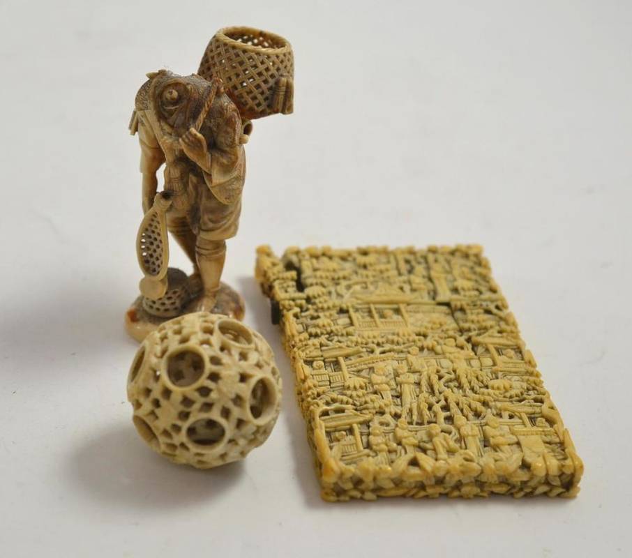 Lot 10 - A Cantonese carved ivory card case, a puzzle ball and a finely carved okimono (a.f.)