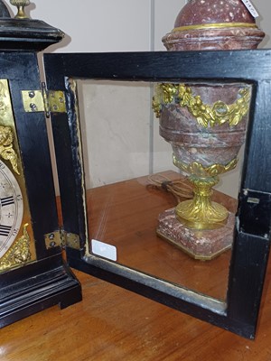 Lot 179 - An Ebonised Chiming Table Clock, signed W...