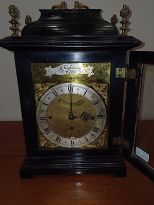 Lot 179 - An Ebonised Chiming Table Clock, signed W...