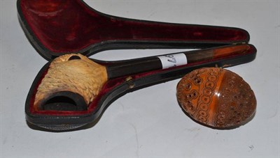 Lot 13 - A pierced nut and a Meerschaum pipe depicting a bird (in case) (2)