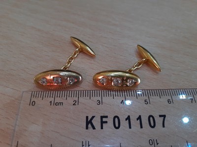 Lot 2120 - A Pair of Diamond Cufflinks the yellow domed...