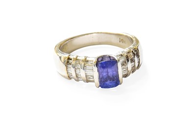 Lot 485 - A Tanzanite and Diamond Ring, the rectangular...