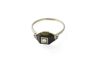 Lot 335 - An Onyx and Diamond Ring, the geometric onyx...