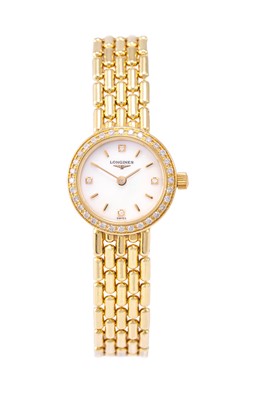 Lot 2216 - Longines: A Lady's 18 Carat Gold Diamond Set...