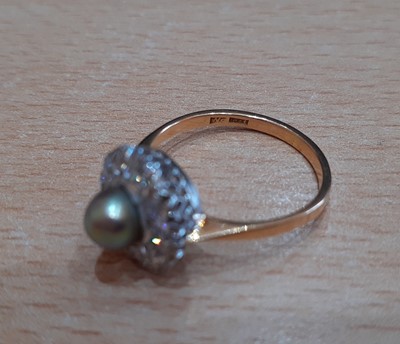 Lot 2133 - A Cultured Pearl and Diamond Ring the cultured...
