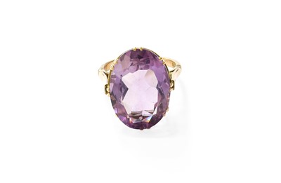 Lot 372 - An Amethyst Ring, the oval cut amethyst in a...