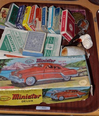 Lot 50 - Mixed collectables including boxed Minster tinplate car, card games, three pipes, maps, medals,...