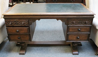 Lot 60 - An Early 20th Century Carved Oak Desk, 138cm...