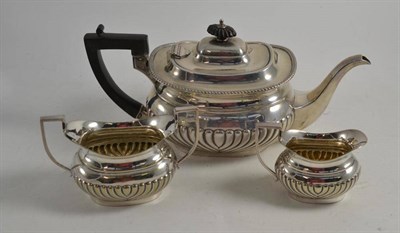 Lot 63 - A silver tea pot, Sheffield 1921 and the matching EPNS sugar and cream jug