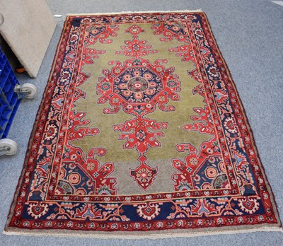 Lot 1025 - North West Persian Rug, the olive green field...