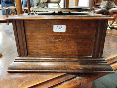 Lot 245 - A Peerless Gramophone, with red toleware horn