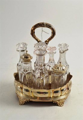 Lot 89 - A George IV silver cruet set with seven cut glass bottles (all good), two with silver mounts,...