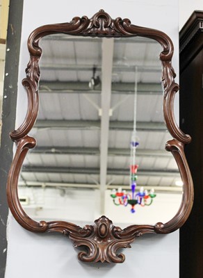 Lot 5 - A Carved Mahogany Framed Mirror, decorated...
