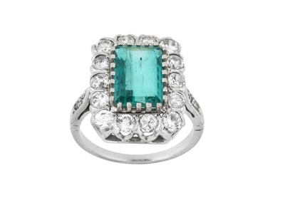 Lot 2333 - An Emerald and Diamond Cluster Ring the...