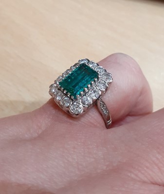 Lot 2333 - An Emerald and Diamond Cluster Ring the...
