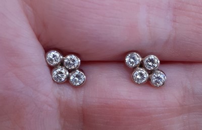 Lot 2057 - A Pair of Diamond Cluster Earrings four round...