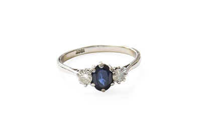 Lot 483 - A Sapphire and Diamond Three Stone Ring, the...